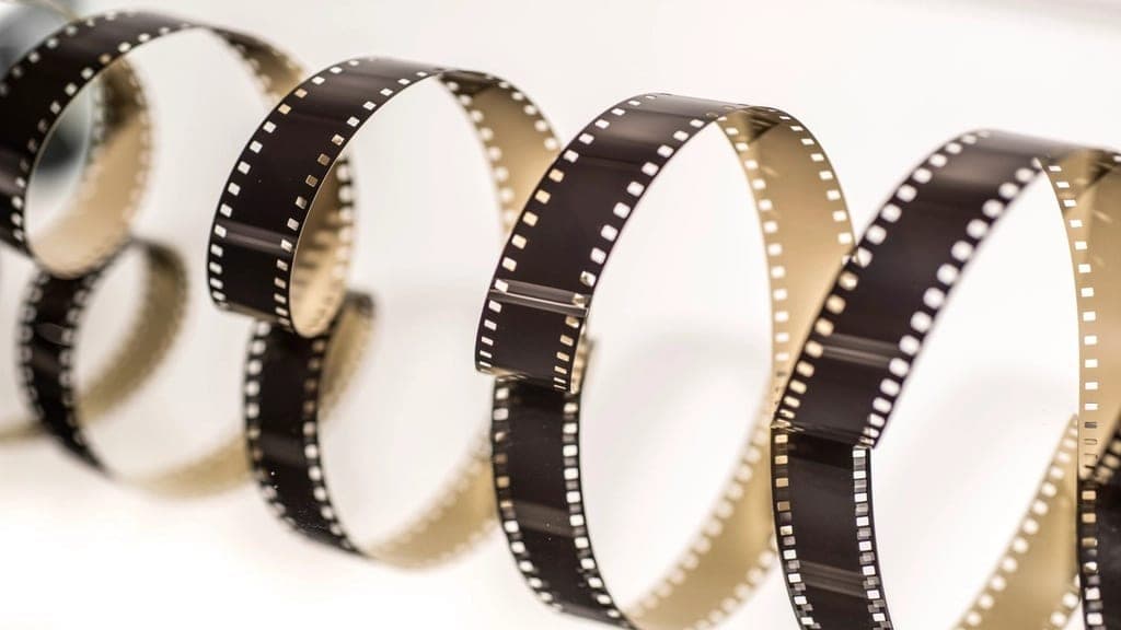 A strip of film curling into a spiral