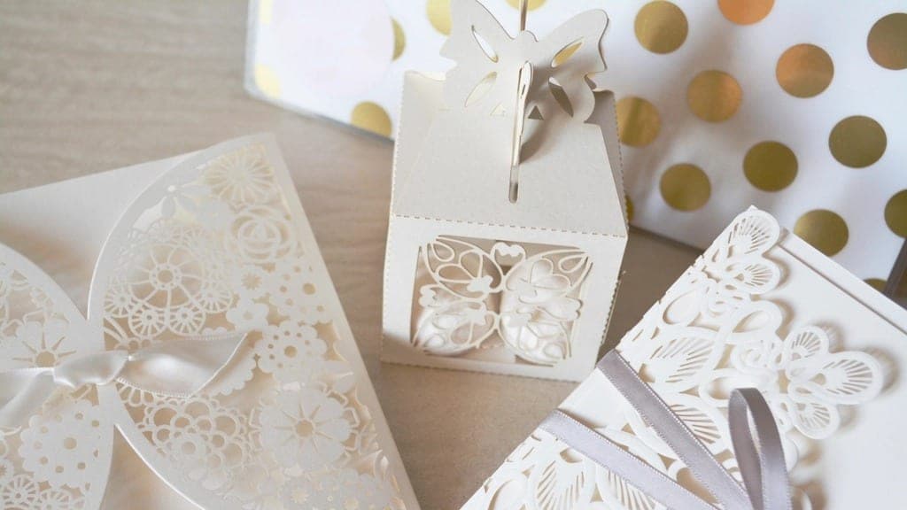 Wedding invitations in cream and gold